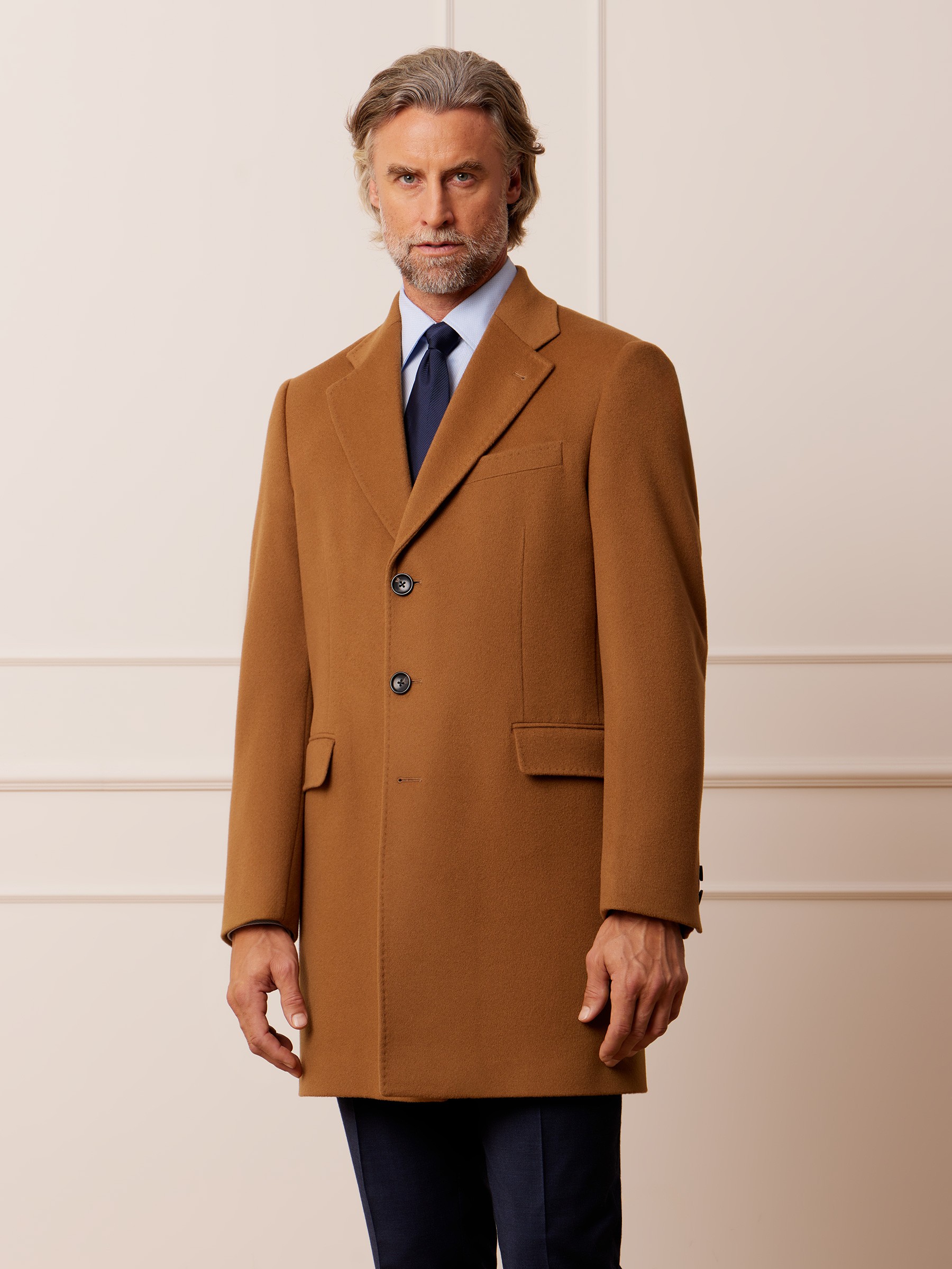 Graphic depicting a hexagonal cropped photo of an interior room design with grid lines along its borders.