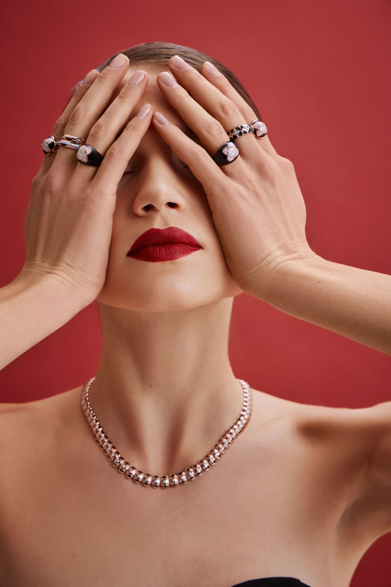 Graphic of a typography specimen showing the alphabet and numerals on top of a dark gray background.