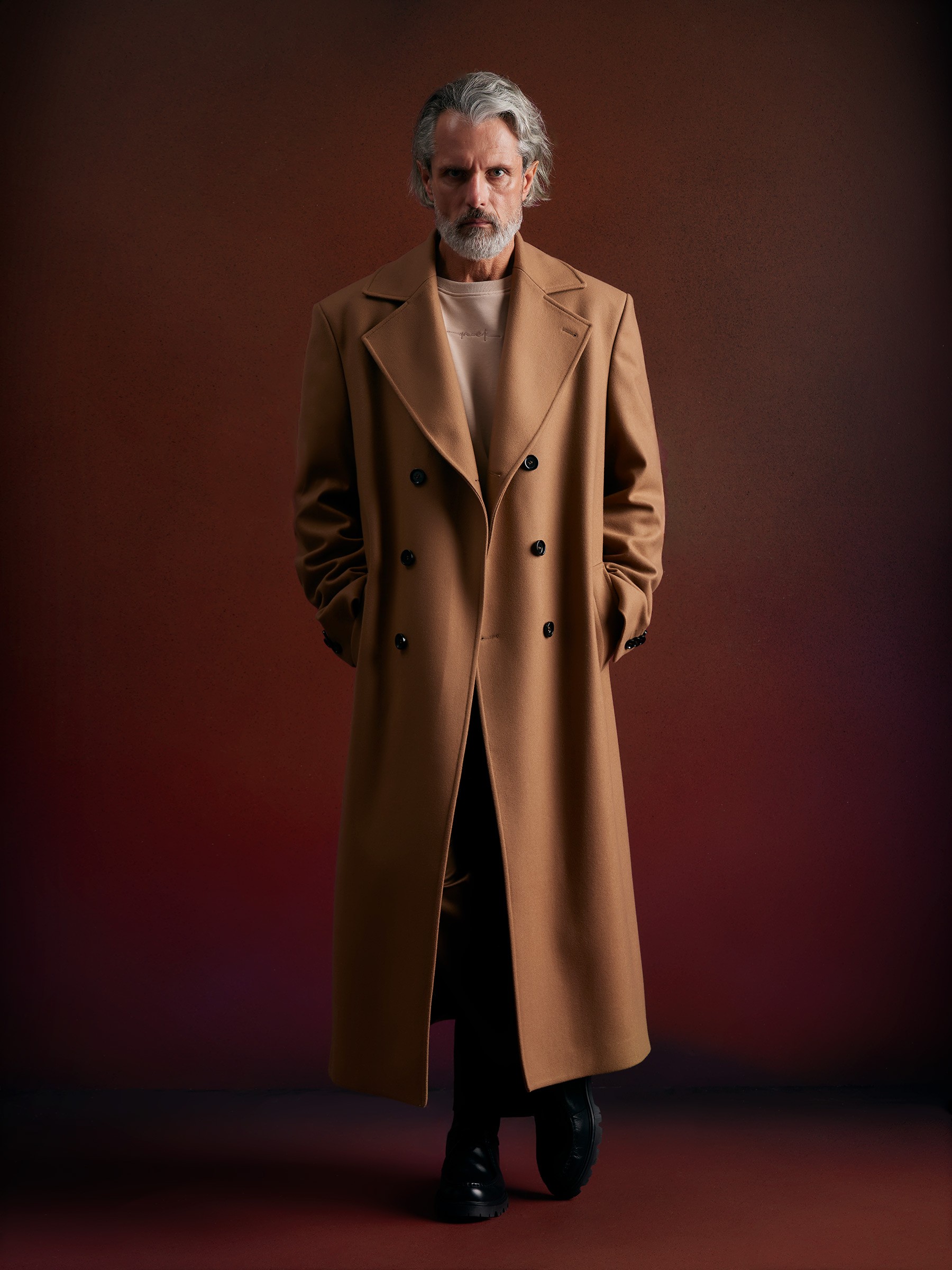 Graphic of a typography specimen showing the alphabet and numerals on top of a dark gray background.