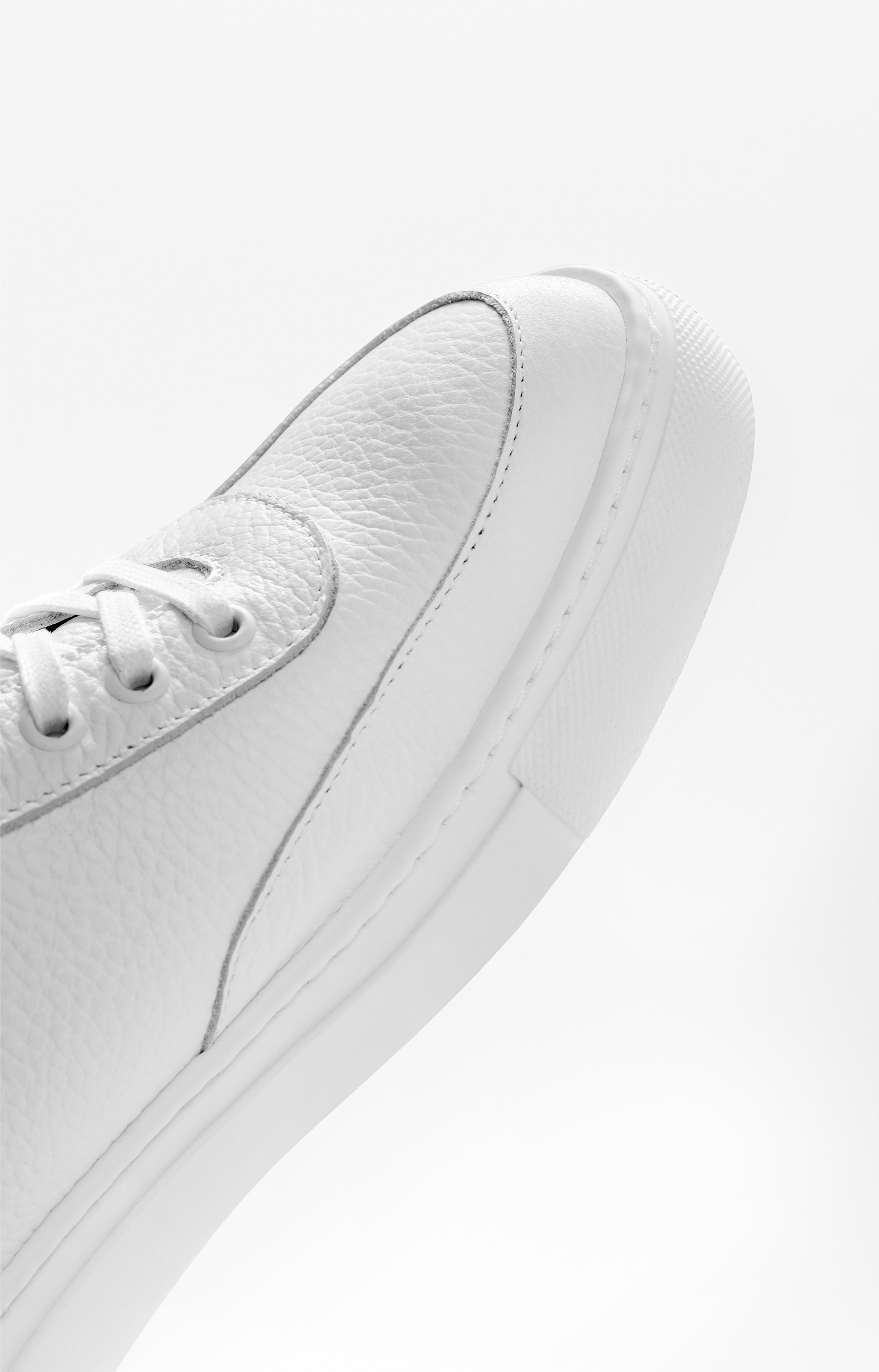 Graphic depicting a hexagonal cropped photo of an interior room design with grid lines along its borders.