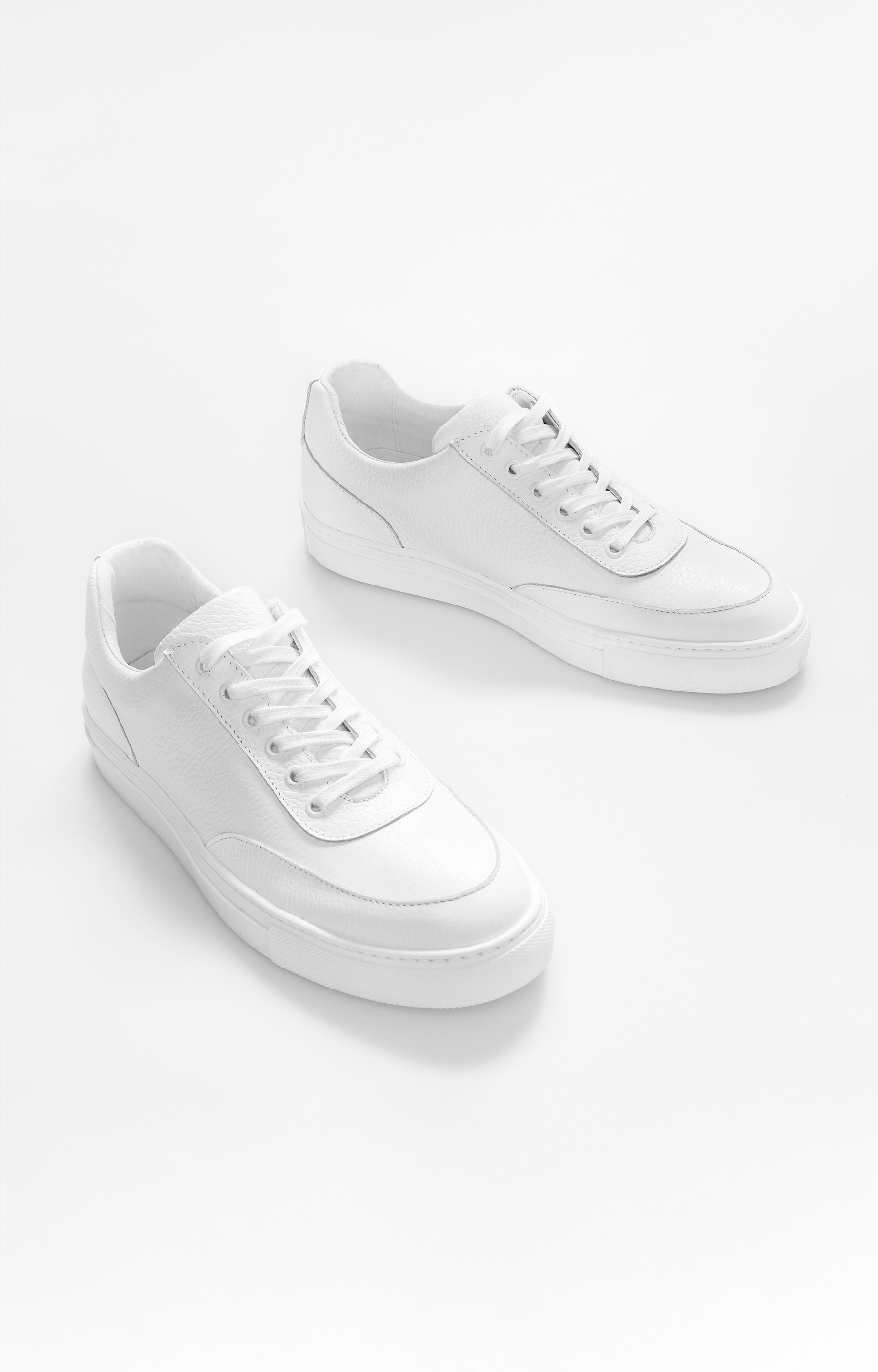 Graphic of a typography specimen showing the alphabet and numerals on top of a dark gray background.